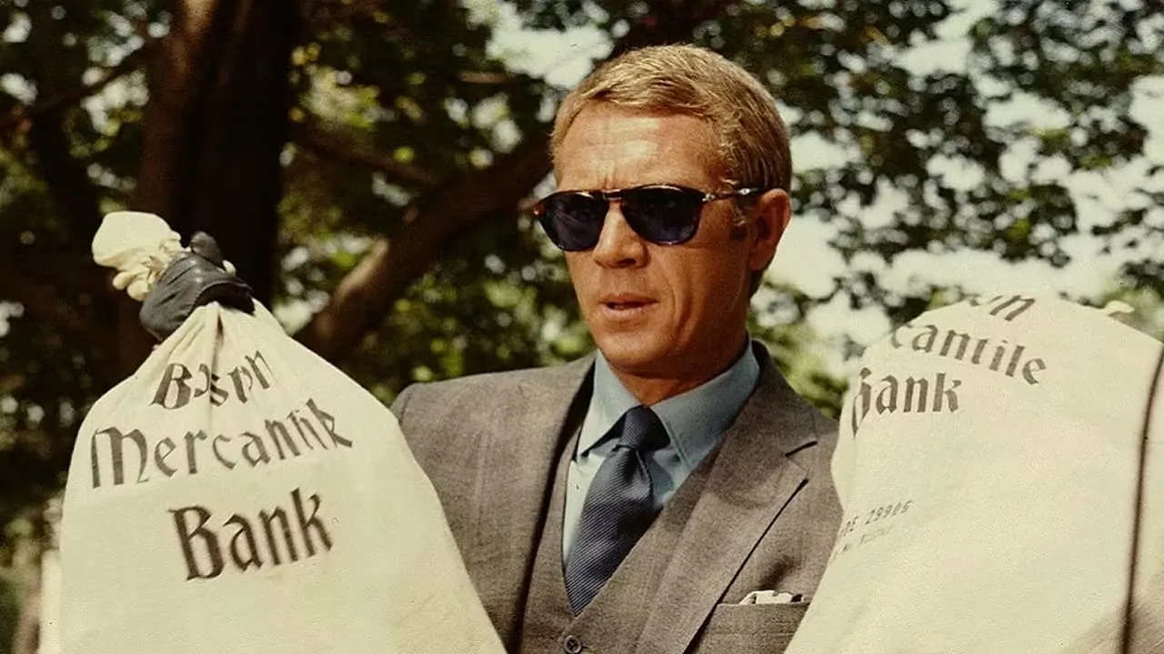 Thomas Crown is holding two bags