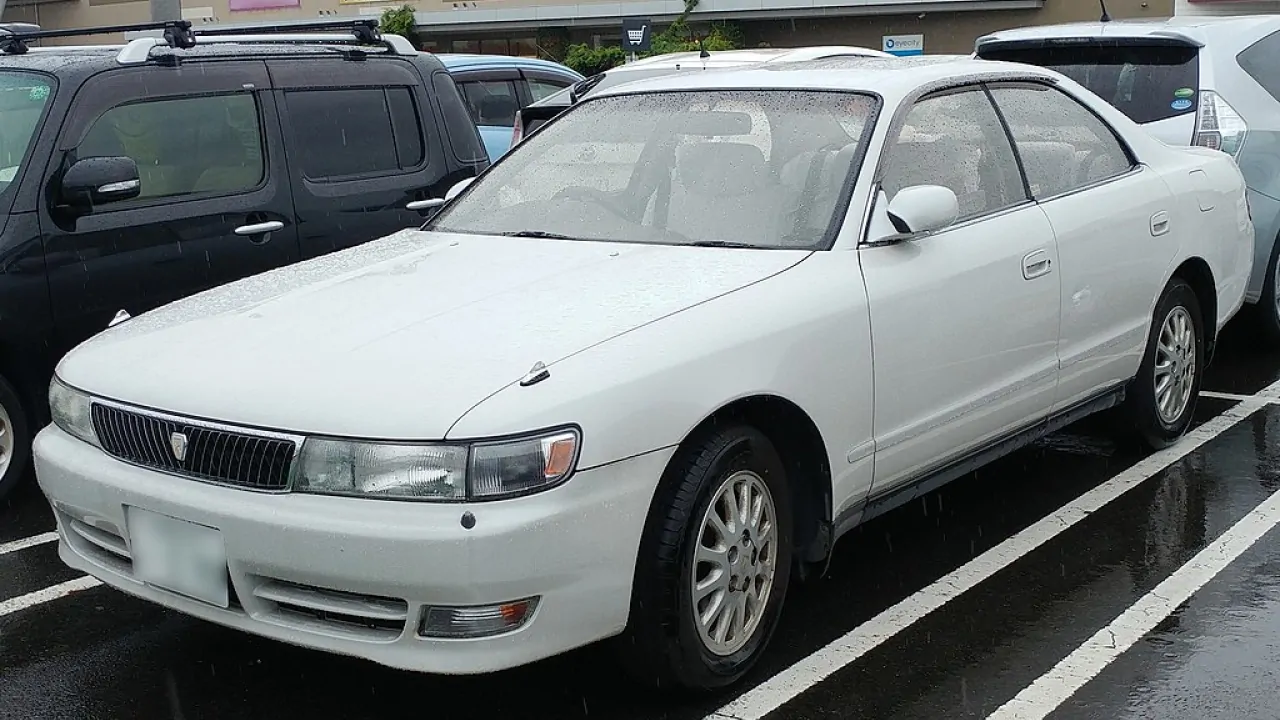 A white toyota chaser parked