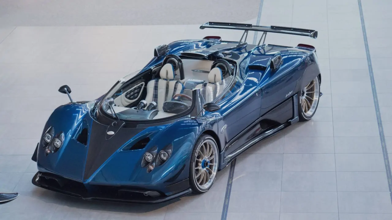 A blue Pagani Zonda HP Barchetta side view, which is one of the most expensive sports cars